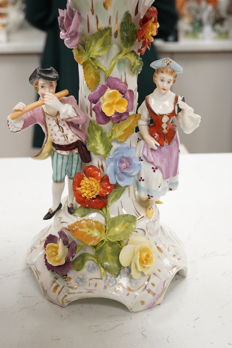 A pair of German porcelain figure groups, late 19th century and a Dresden centrepiece bowl-29cm high